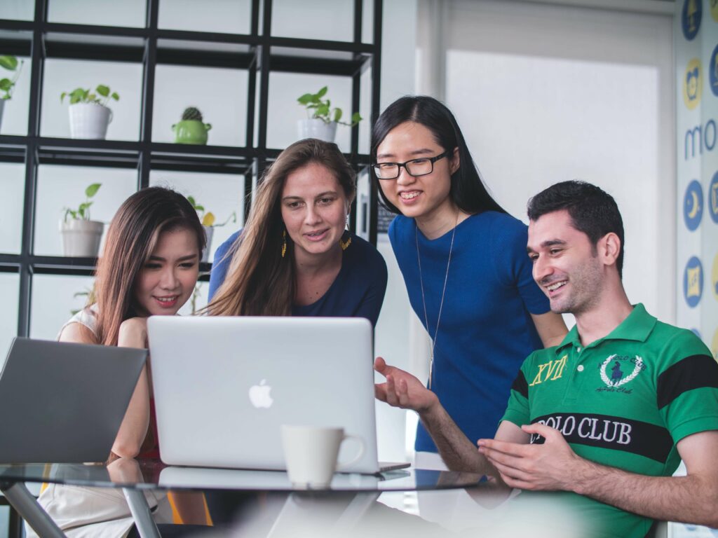 group of people happy at computer
